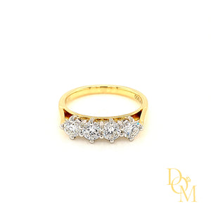 four stone diamond ring with each round stone in a NSEW platinum setting and with a yellow gold shank
