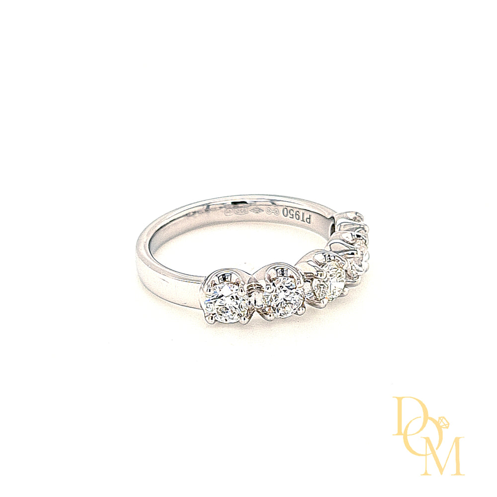 platinum 5 stone ring with four claws on each diamond and a scalloped edge around the curve of each diamond. Low setting