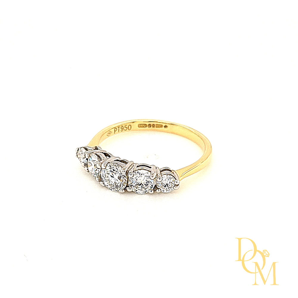 Five stone diamond ring with 5 round diamonds, graduating in size and each in a four claw setting. White setting & yellow band