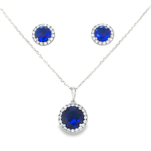 Round cluster pendant & earring set with sapphire blue cz in the centre surrounded by white CZs on a white background.