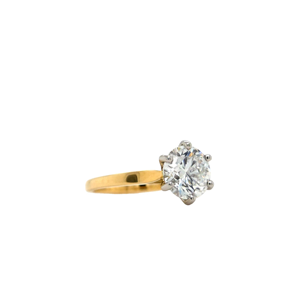 Round lab grown diamond in a six claw platinum setting with a slightly tapered 18ct yellow gold shank