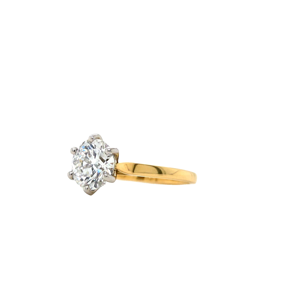 Round lab grown diamond in a six claw platinum setting with a slightly tapered 18ct yellow gold shank