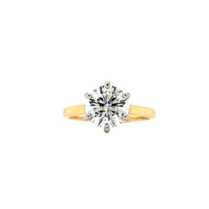 Round lab grown diamond in a six claw platinum setting with a slightly tapered 18ct yellow gold shank