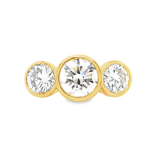 18ct yellow gold three stone engagement ring with bezel set lab grown diamonds.