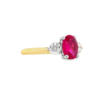 Side profile of 18ct gold and platinum ruby and diamond ring showing four-claw ruby mount and platinum three-claw diamond settings.