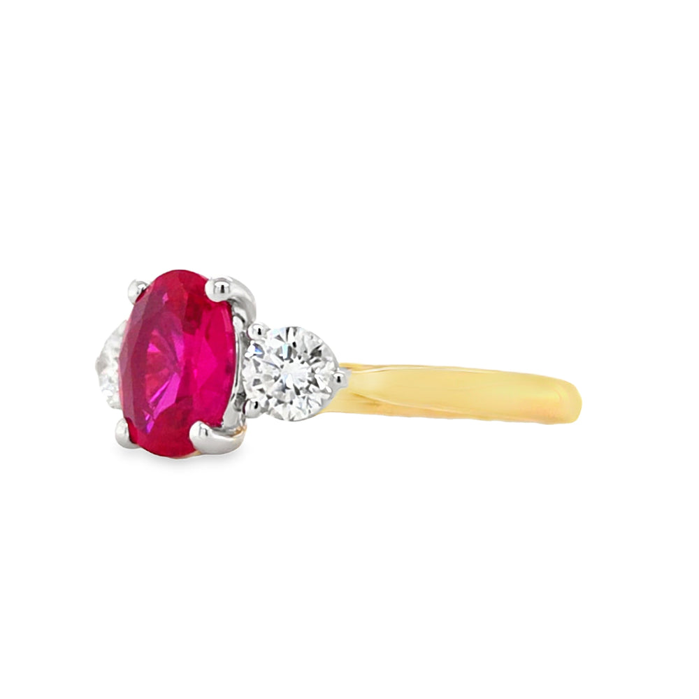 Side profile of 18ct gold and platinum ruby and diamond ring showing four-claw ruby mount and platinum three-claw diamond settings.