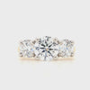 Three graduating round brilliant-cut lab grown diamonds each in a four claw platinum setting with a tapered 18ct yellow gold shank