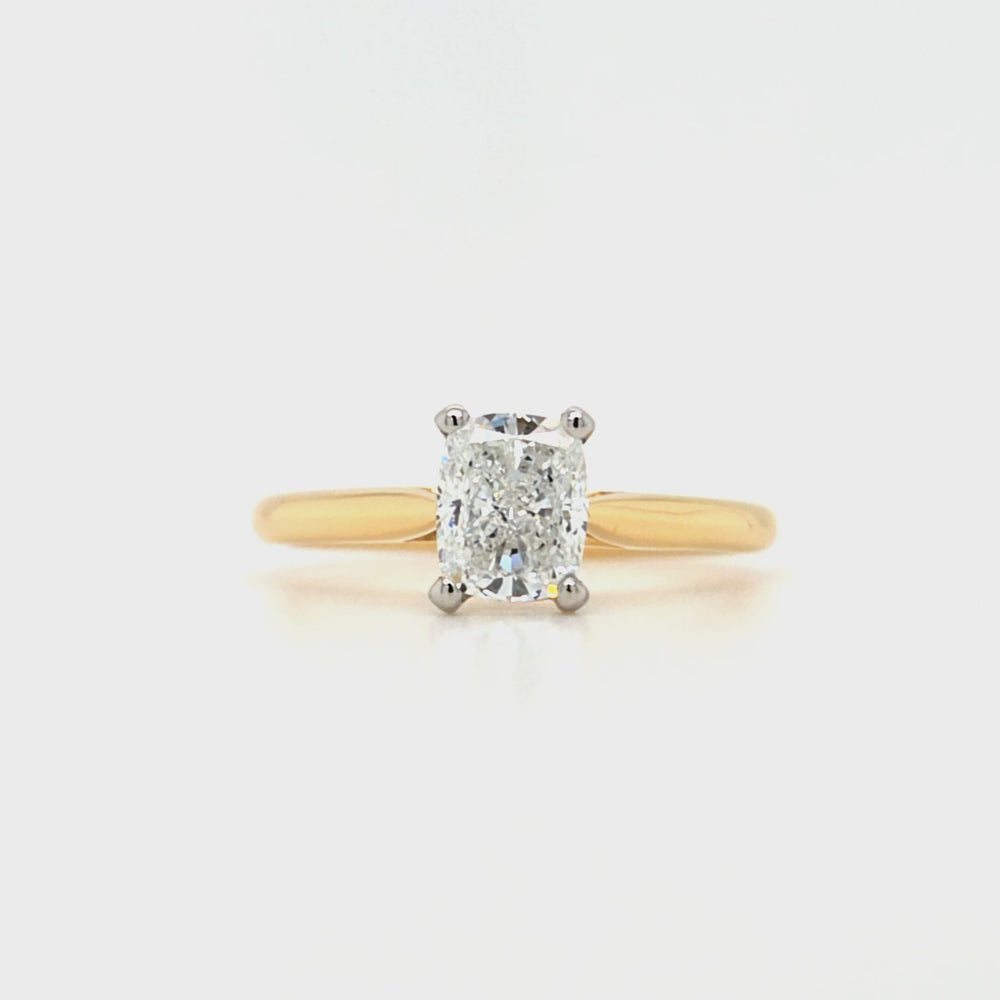 
                
                    Load and play video in Gallery viewer, 18ct yellow gold and platinum elongated cushion-cut diamond solitaire engagement ring, 1.00ct F colour mined diamond, GIA certified, featuring tapered yellow gold band and platinum claw setting on a white background.
                
            