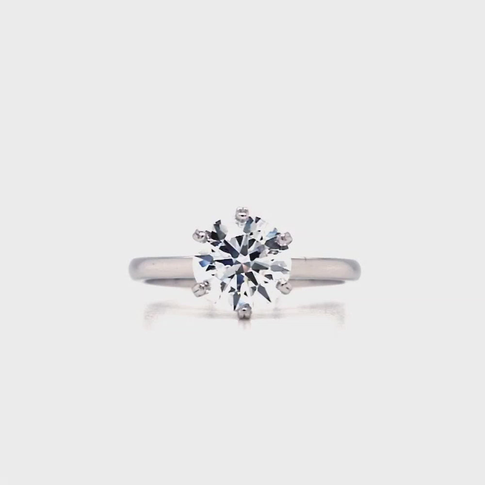 
                
                    Load and play video in Gallery viewer, A round lab grown diamond, set in a six claw setting with a plain, slim shank.
                
            