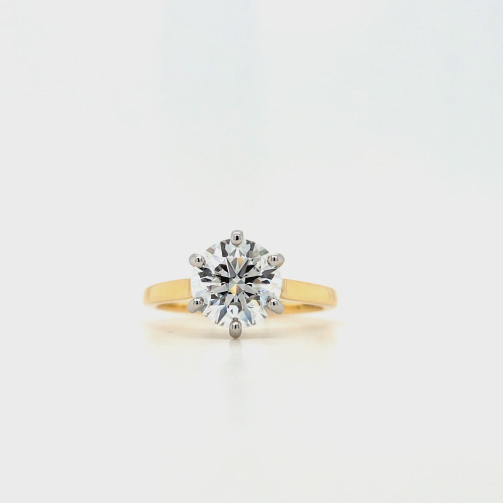 
                
                    Load and play video in Gallery viewer, Round lab grown diamond in a six claw platinum setting with a slightly tapered 18ct yellow gold shank
                
            