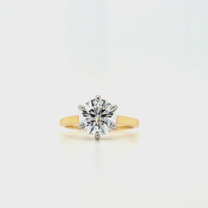 
                
                    Load and play video in Gallery viewer, Round lab grown diamond in a six claw platinum setting with a slightly tapered 18ct yellow gold shank
                
            
