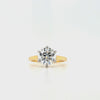 Round lab grown diamond in a six claw platinum setting with a slightly tapered 18ct yellow gold shank