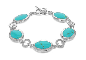 Sterling silver turquoise bracelet with 5 oval turquoise links joined with plain circular links and T-bar clasp