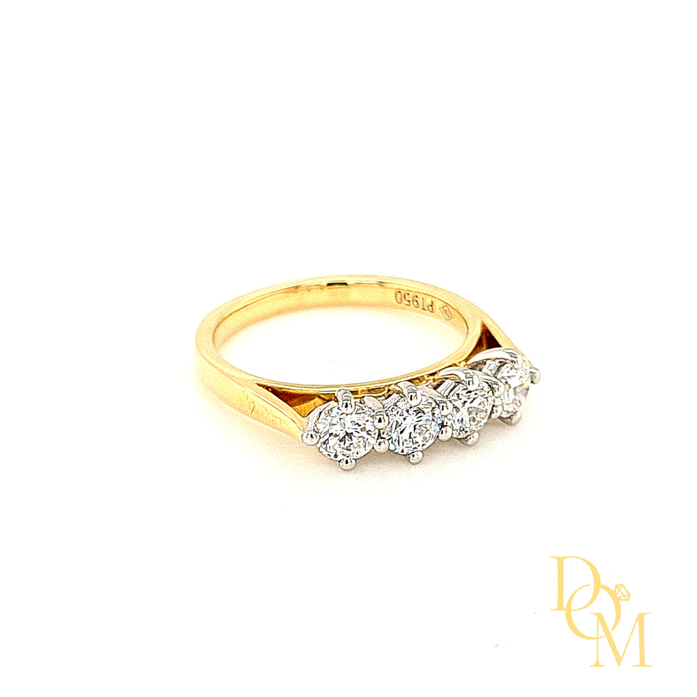 four stone diamond ring with each round stone in a NSEW platinum setting and with a yellow gold shank