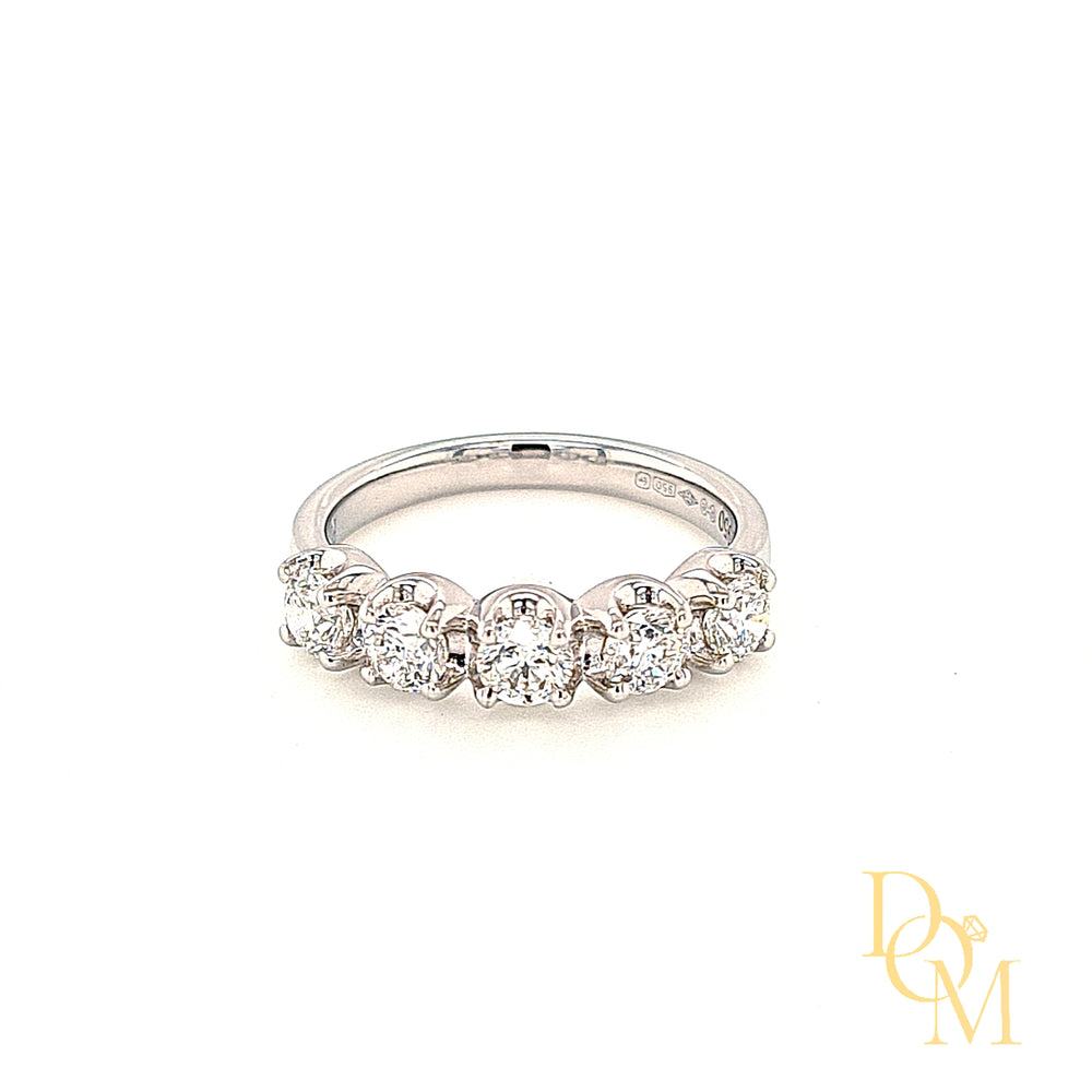 platinum 5 stone ring with four claws on each diamond and a scalloped edge around the curve of each diamond. Low setting