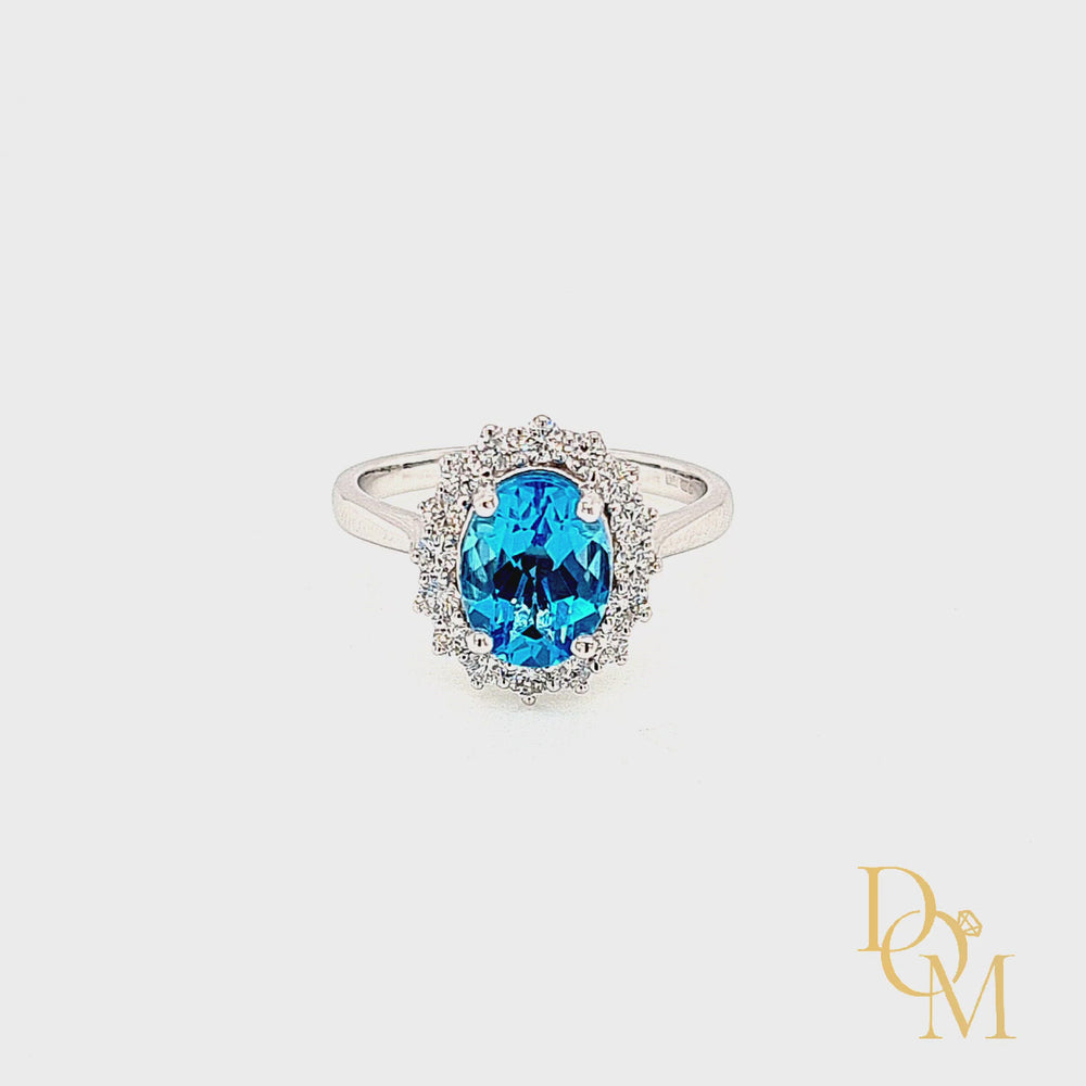 
                
                    Load and play video in Gallery viewer, 9ct White Gold Oval Blue Topaz &amp;amp; Diamond Cluster Ring
                
            