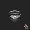 Platinum 3 stone engagement ring. Round centre in a four claw setting with a pear cut diamond on either side
